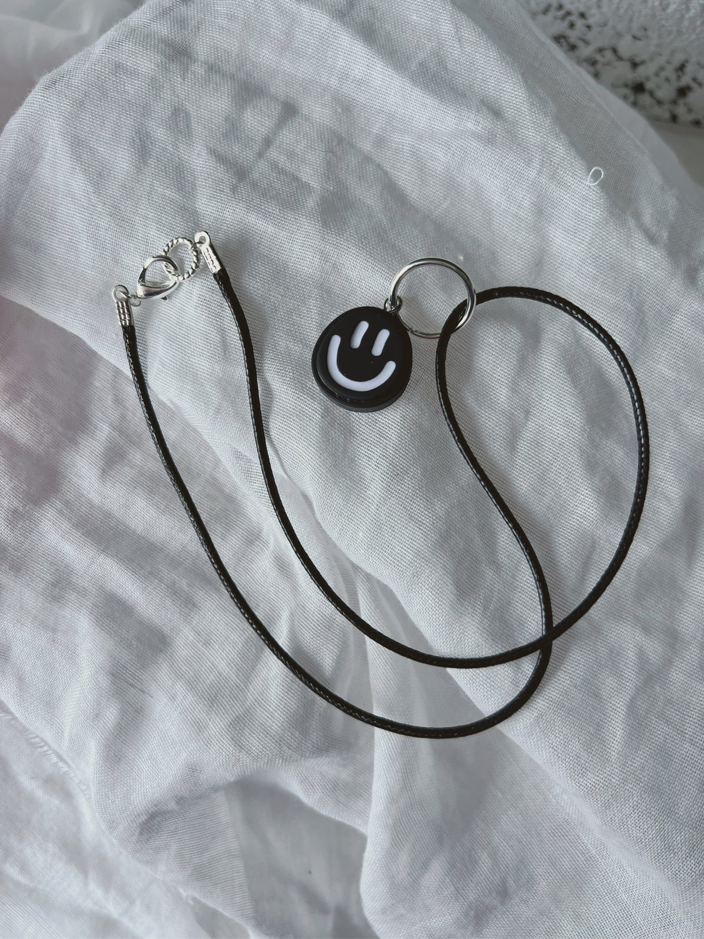 The charm: Black & white smile