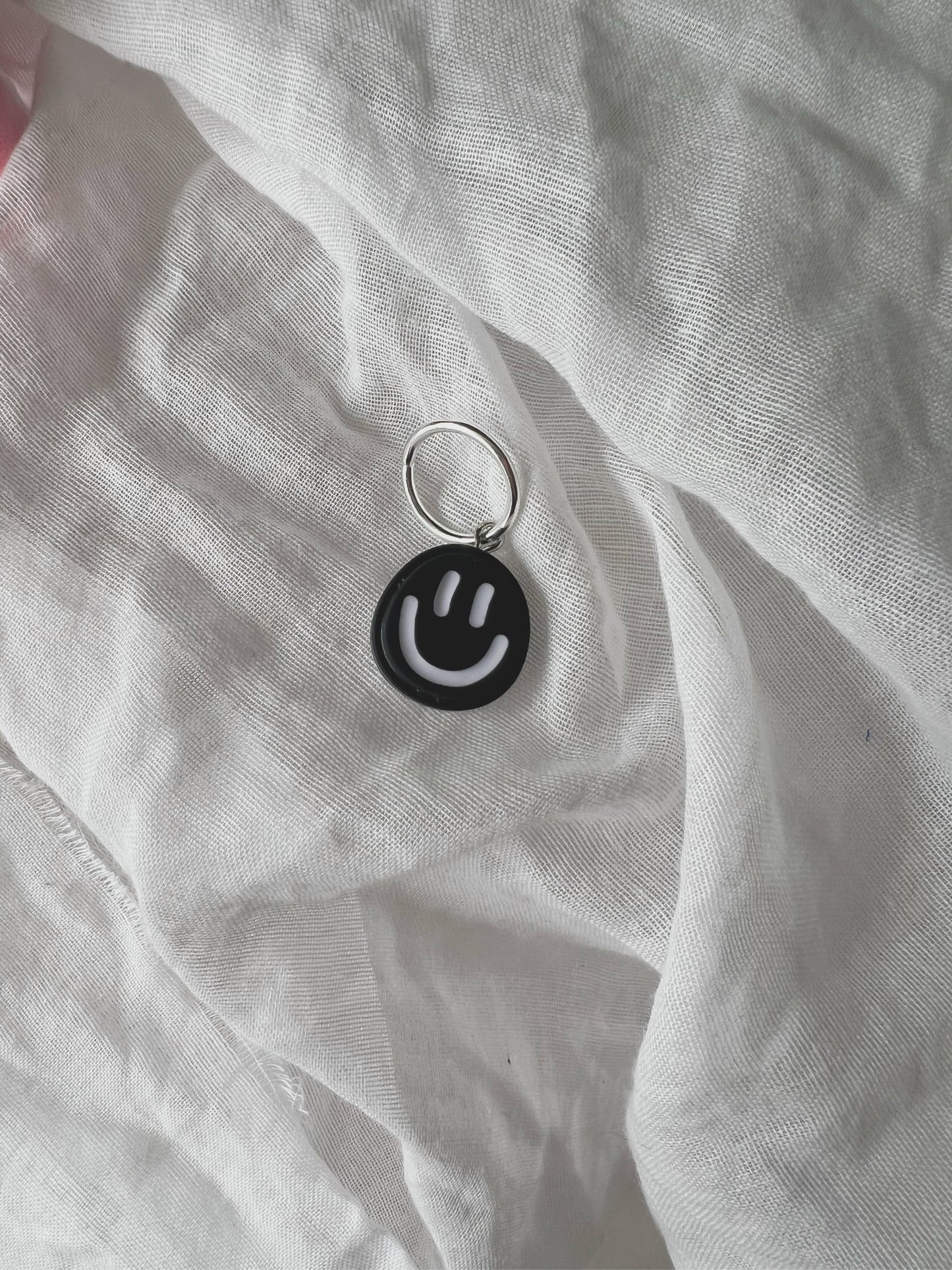 The charm: Black & white smile