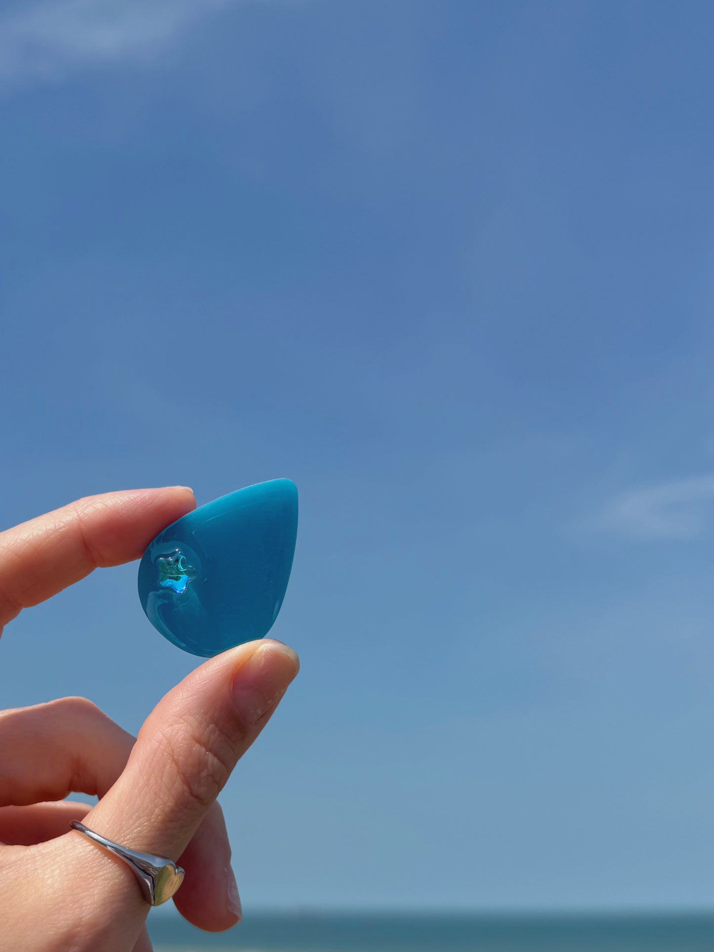 Teal star tear drop orb
